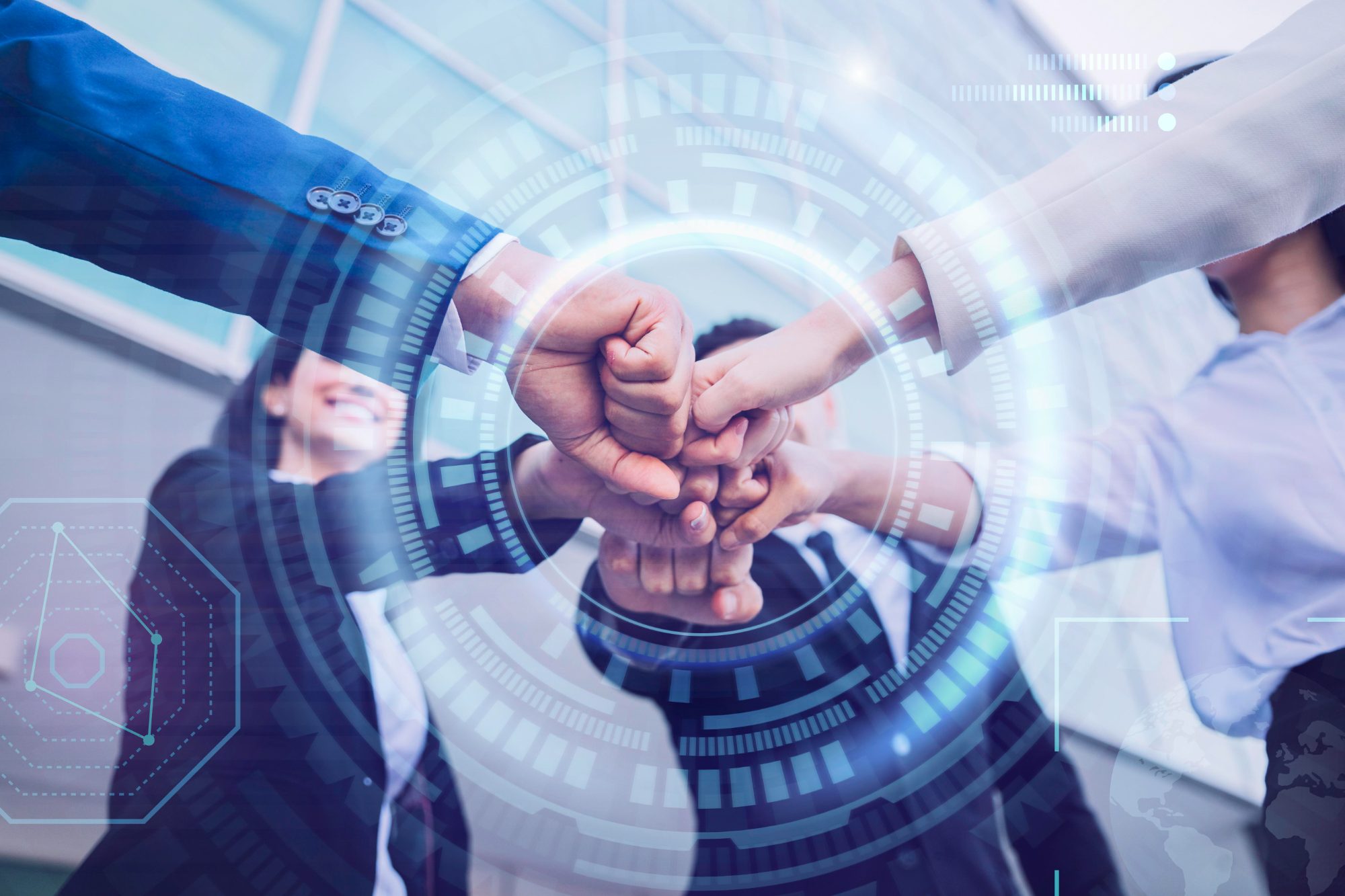Team joining fists over a digital network overlay